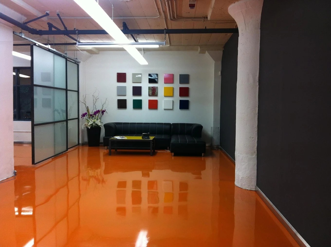 Glossy orange epoxy floor installation - Mr. Epoxy and Paint craftsmanship